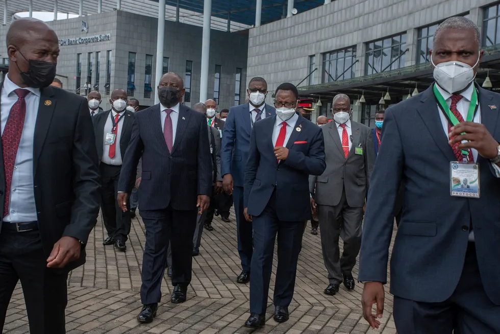 Mozambique focus: Malawi’s President Lazarus Chakwera (centre-right) and chairman of the SADC Organ on Politics, Defence & Security Cooperation, South African President Cyril Ramaphosa (centre-left) walk side by side at the end of the SADC extraordinary summit in Lilongwe, Malawi