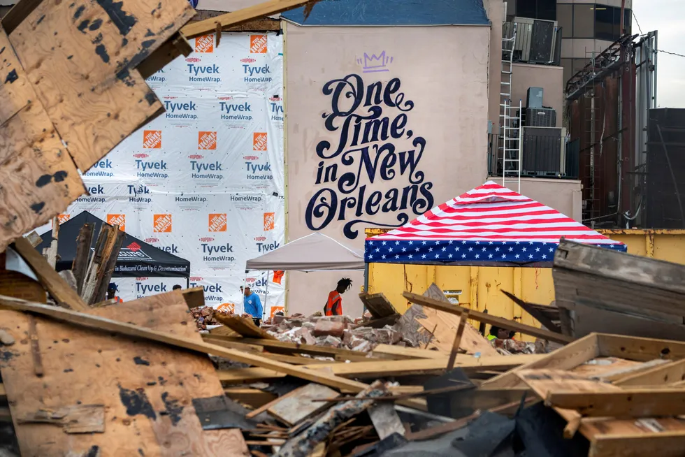 Slow recovery: Workers clean up the site of a building that collapsed during Hurricane Ida in New Orleans, Louisiana. About 77% of US Gulf production remains offline on Wednesday.