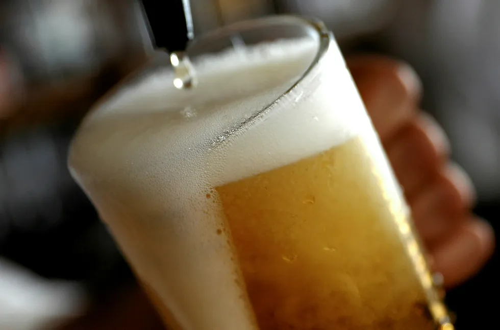 On tap: A pint of beer is poured into a glass in a bar in London