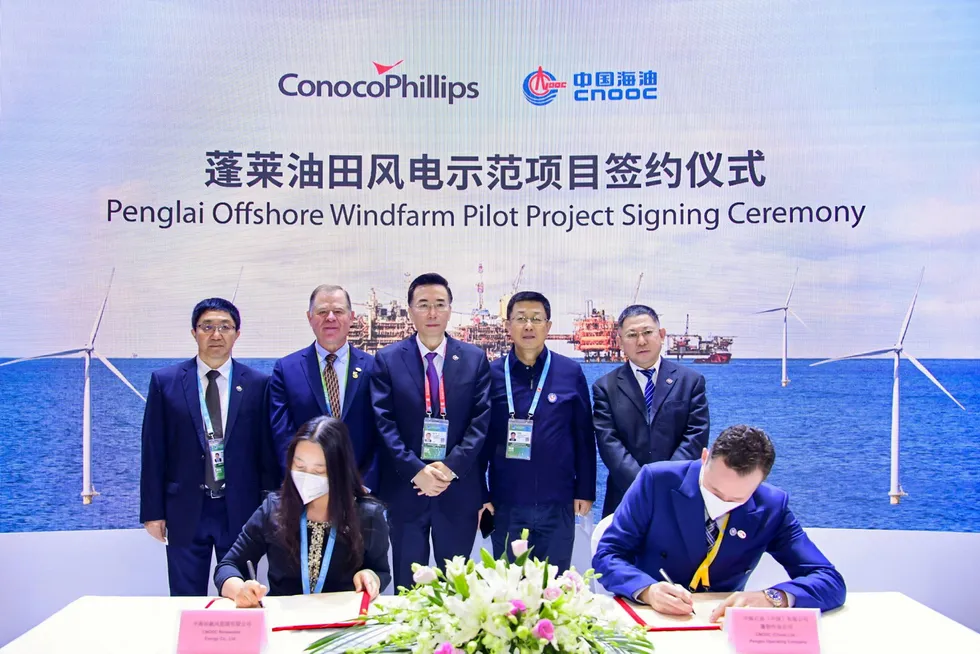 Done deal: signing the agreement for ConocoPhillips’ offshore wind farm in China’s Bohai Bay.