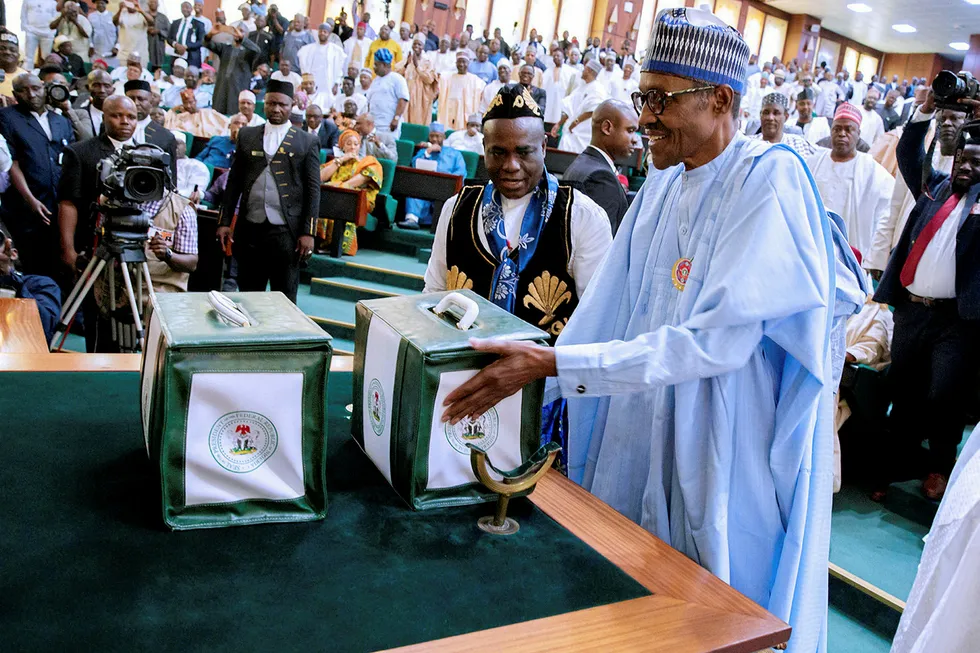 Shadow: President Muhammadu Buhari presents the 2018 National budget to the National Assembly in Abuja, Nigeria