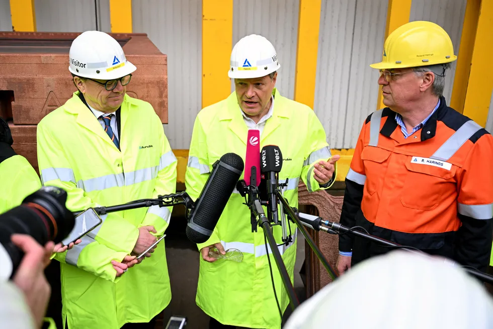 German deputy chancellor Robert Habeck, centre, Canadian energy ninister Jonathan Wilkinson (left) and Aurubis CEO Roland Harings (right) address journalists during a visit to Aurubis facilities in Hamburg, northern Germany, on March 18.