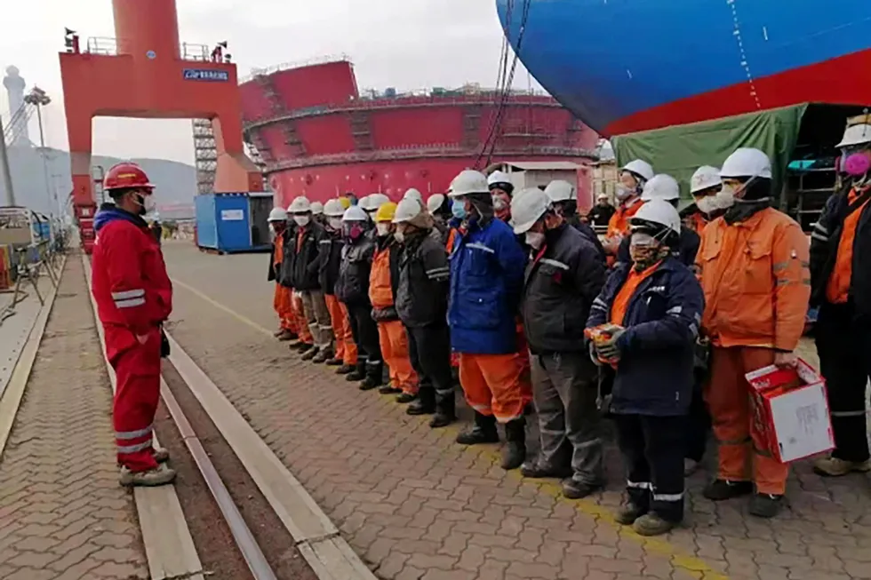 Workers at COOEC's Qingdao yard in China.