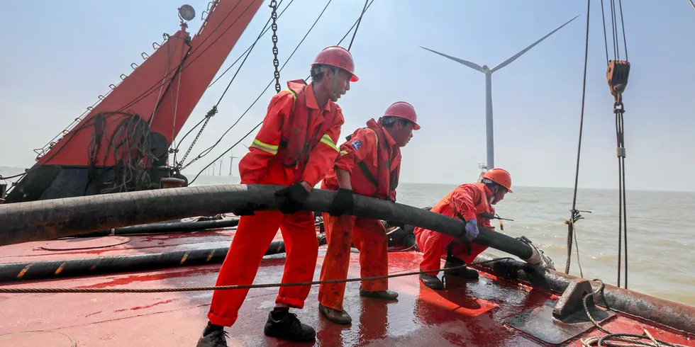 Employees of State Grid Corporation of China at an offshore wind farm in Zhoushan, Zhejiang Province.