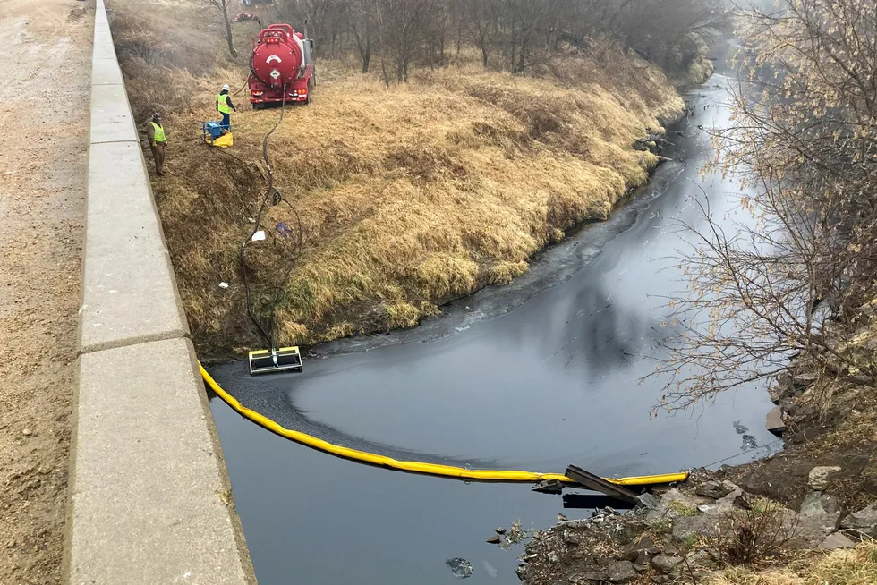 Keystone spill: a remediation company deploys a boom on the surface of an oil spill after the Keystone pipeline ruptured at Mill Creek in Washington County, Kansas, on 8 December 2022.