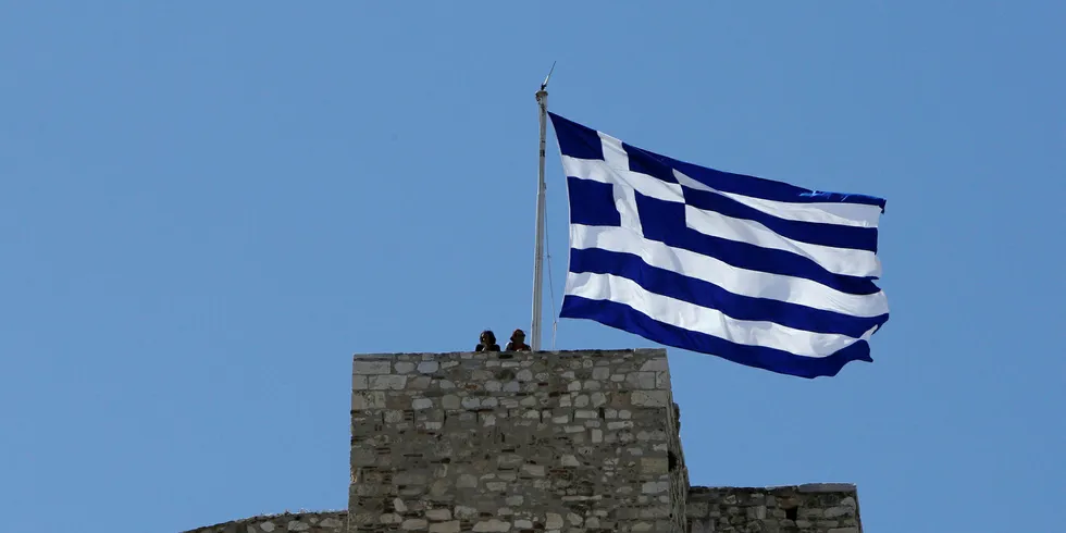 A Greek flag, overlooking Athens