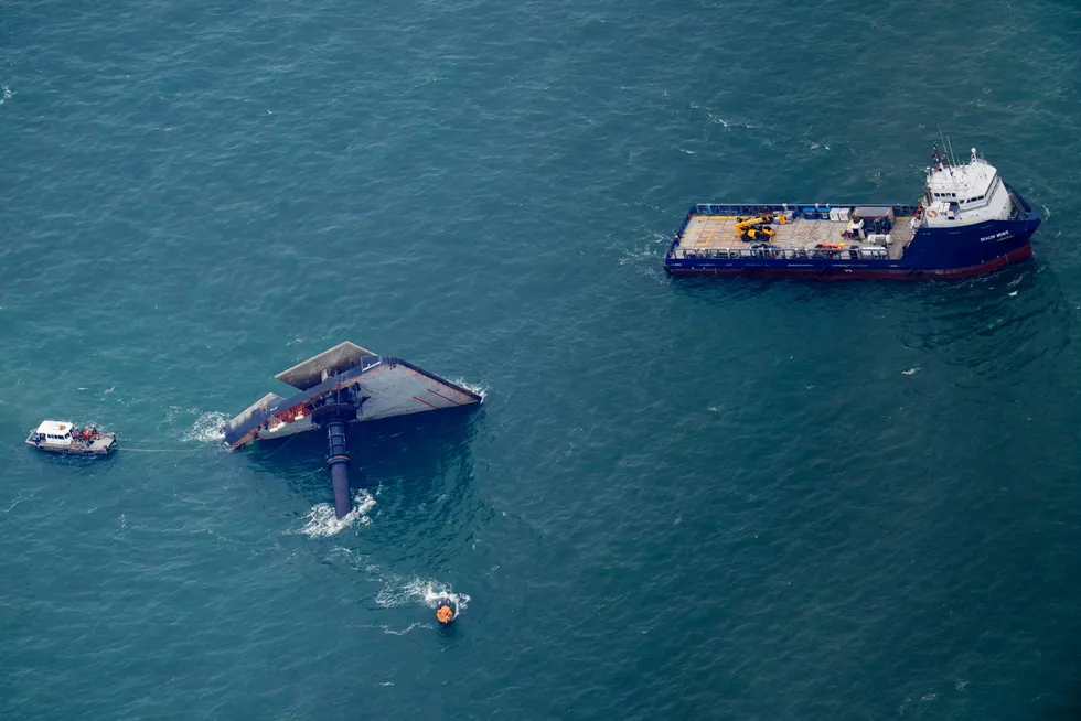 Deadly voyage: rescue boats are seen next to the capsized liftboat Seacor Power eight miles off the coast of Louisiana in the US Gulf of Mexico