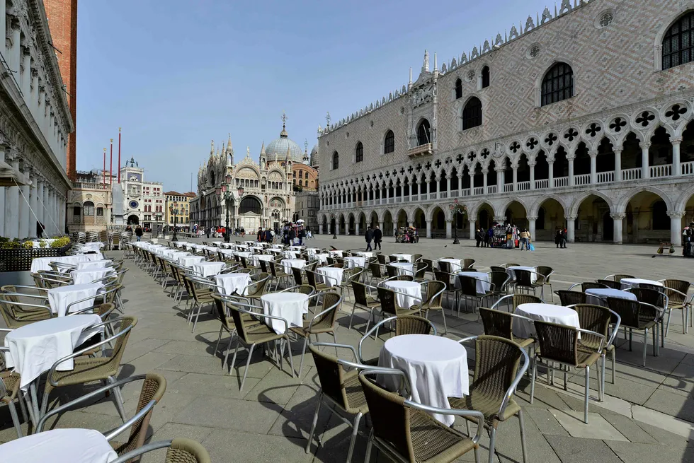 Empty tables: in front of the Doge palace in Venice as Italy shut down schools and universities on Thursday in response to the spread of the coronavirus