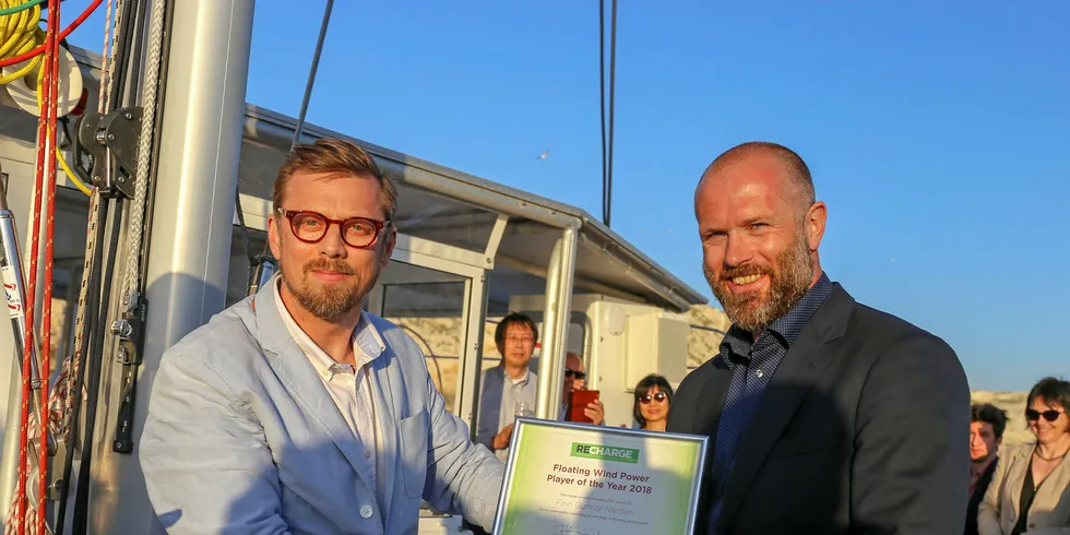 On behalf of winner Finn Gunnar Nielsen, Hywind project director Sebastian Bringsvaerd (right) collects the Recharge Floating Wind Power Player of the Year award from Editor-in-Chief Darius Snieckus.