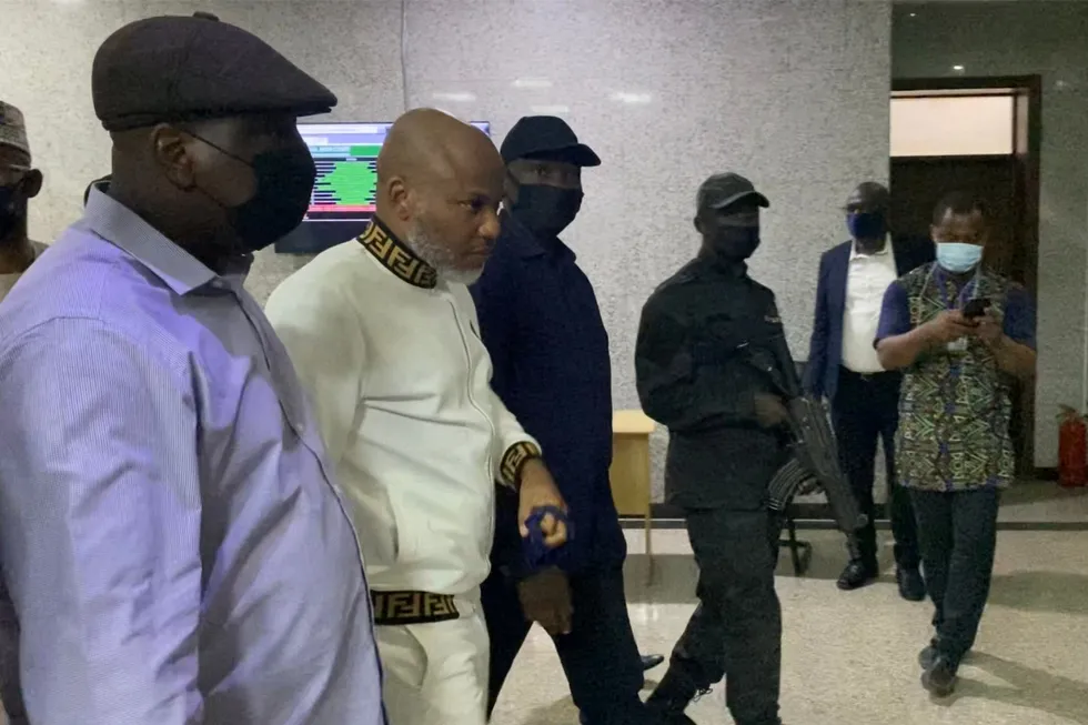 Wanted man: Nigerian secret police escort Nnamdi Kanu (second left, dressed in white), leader of the Indigenous People of Biafra, at the Federal High Court in Abuja in October 2021