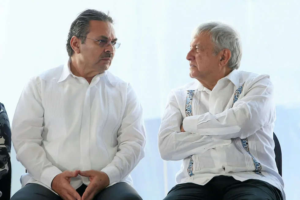 Politicos: Pemex chief executive Octavio Romero Oropeza (left) and President Andres Manuel Lopez Obrador put their heads together over the oil question