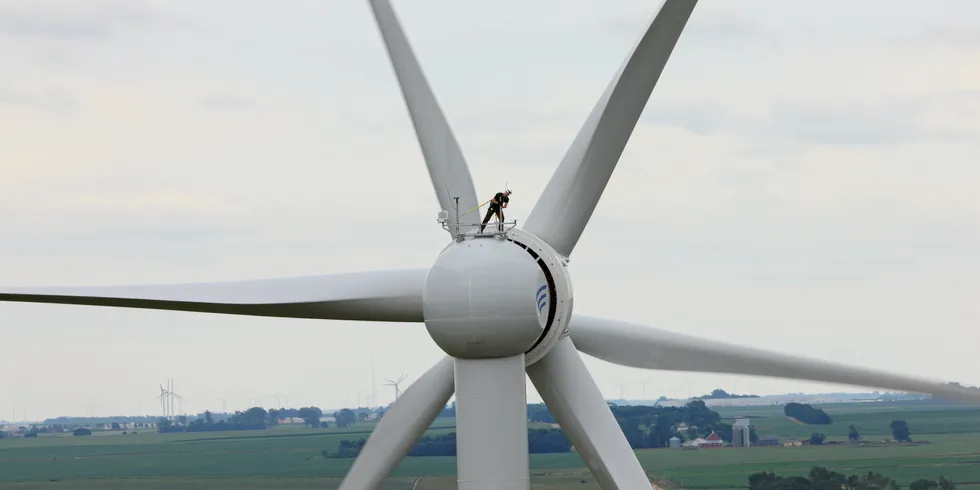 Technician atop Goldwind wind turbine in China