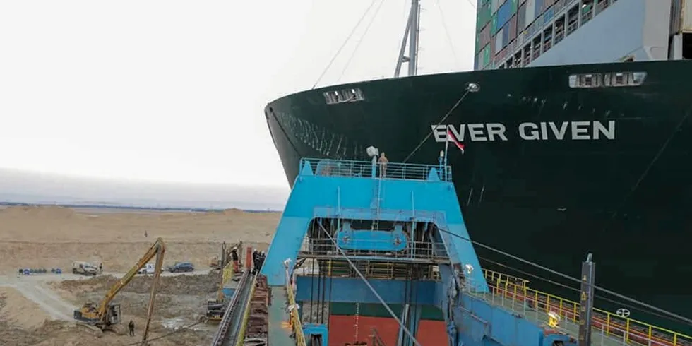 Dredgers try to remove sand from around the 20,388-teu Ever Given (built 2018).