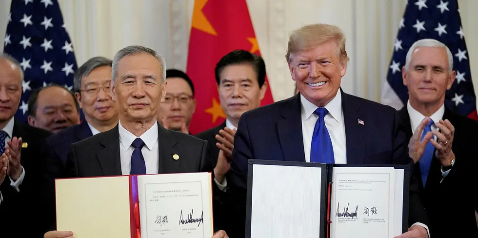 US President Donald Trump stands Chinese Vice Premier Liu He after signing "phase one" of the US-China trade agreement in the East Room of the White House in Washington, U.S., January 15, 2020.