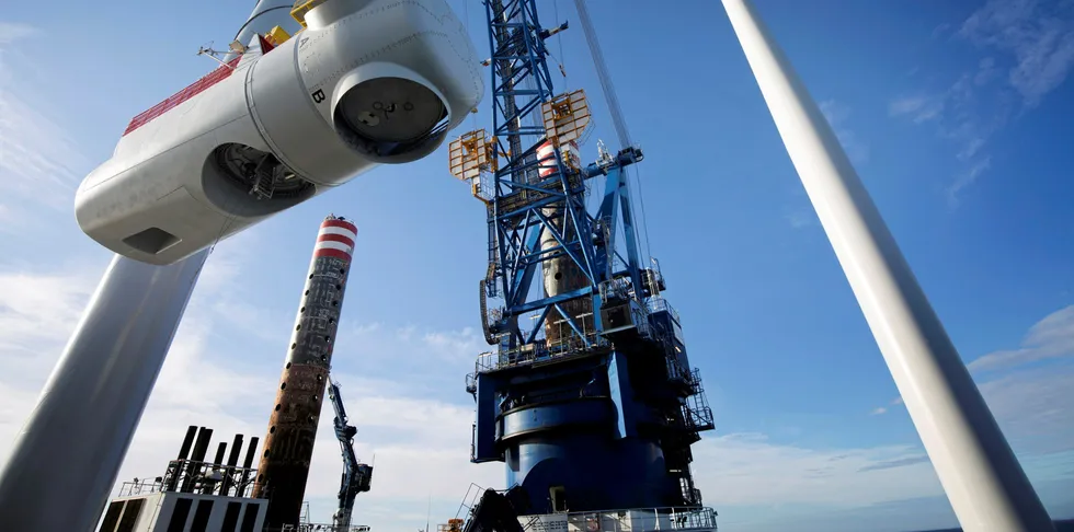 Nacelle installation atop a turbine tower off the UK.