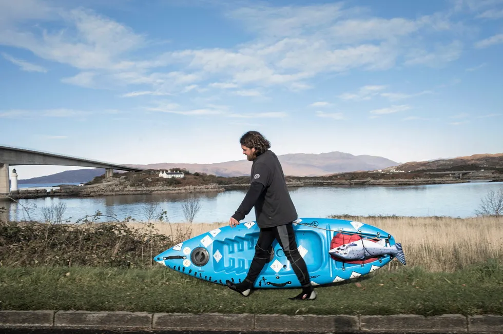 Don Staniford prepares to set off in his kayak to film a Mowi fish feed factory on the Isle of Skye.