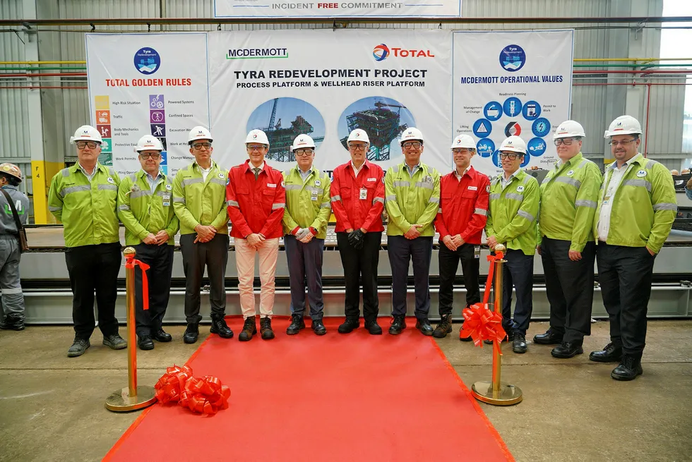 Steel cutting: McDermott and Total representatives and executives including McDermott chief executive David Dickson and Patrick Gilly, managing director, Total E&P Denmark, at the Batam Island yard in October 2018