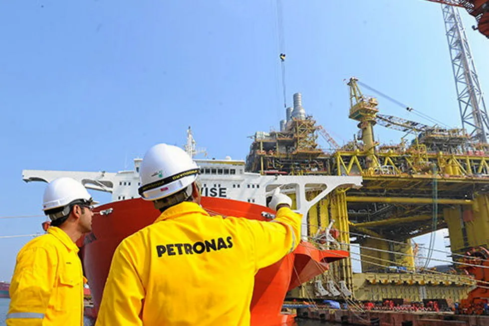 Hard at work: Petronas employees