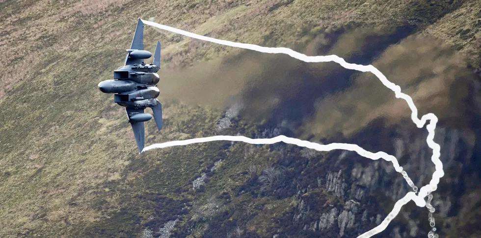 DOLGELLAU, WALES - FEBRUARY 16: A United States Air Force F-15 fighter jet based at RAF Lakenheath speeds through the Dinas Pass, known in the aviation world as the Mach Loop on February 16, 2018 in Dolgellau, Wales. United Kingdom. The Royal Air Force and aircraft of the United States use the valleys of Snowdonia to practice low flying techniques and pilot training. The mountain peak vantage points attract aviation enthusiasts from all over the world who hope for a glimpse of their favourite military aircraft spending days waiting for the un-published and un-scheduled fly pasts. (Photo by Christopher Furlong/Getty Images) . Jet.