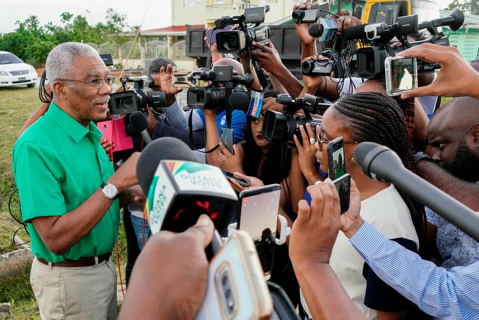 Counting; Guyana's incumbent presidential candidate David Granger speaks with with journalists after casting his vote in general elections on March 2, 2020