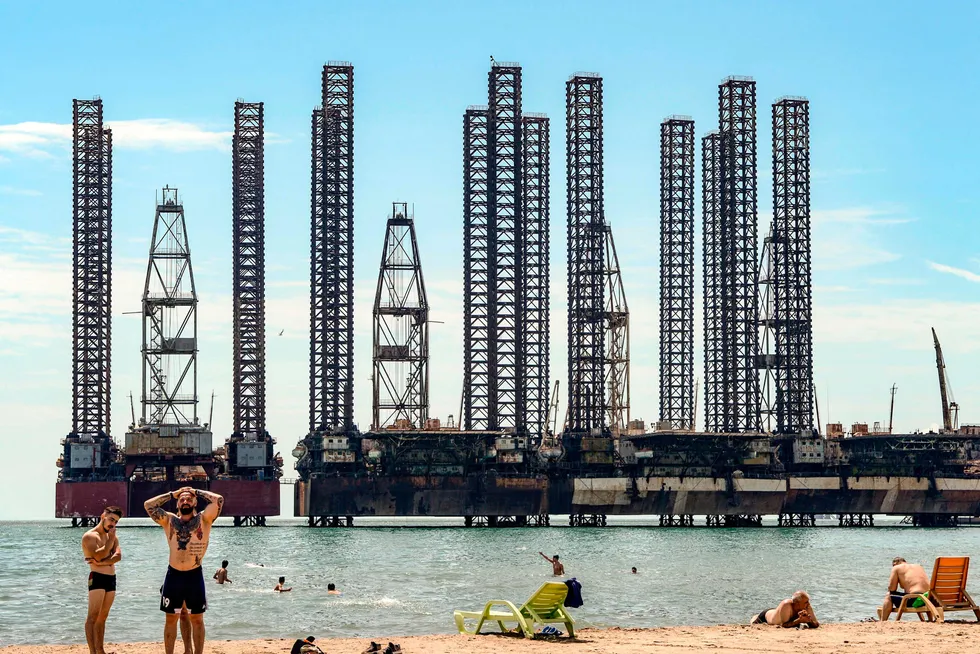 In the shallows: stacked jack-up rigs near the shore of the Caspian Sea, Azerbaijan