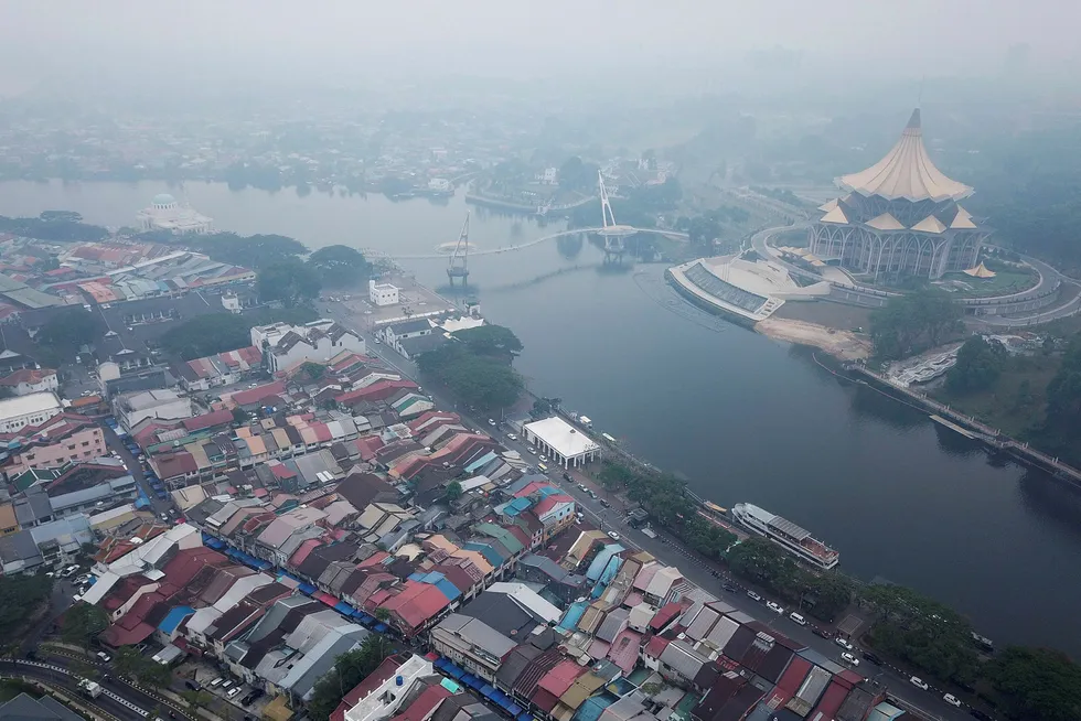 Haze shrouds the ariel view around Sarawak Legislative Assembly building (R) in Kuching, the capital city of Sarawak state on the island of Borneo