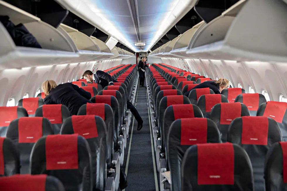 En passasjer får refusjon fra Norwegian etter å ha betalt dyrt for flysete gjennom en prisauksjon.