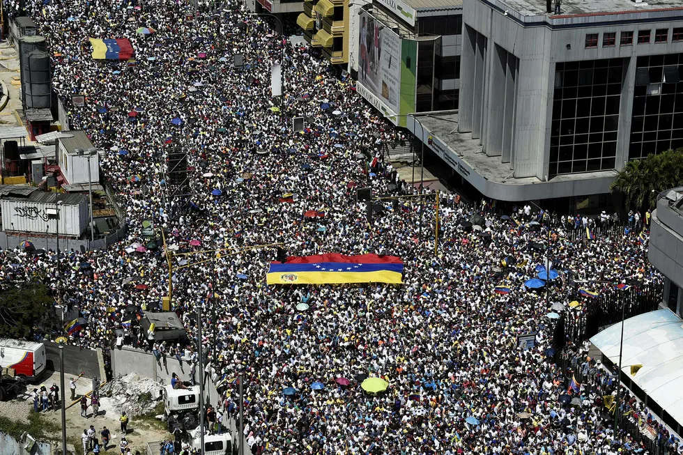 Momentum: activists display Venezuelan flags as they pour to the streets in Caracas in support of Venezuelan opposition leader Juan Guaido