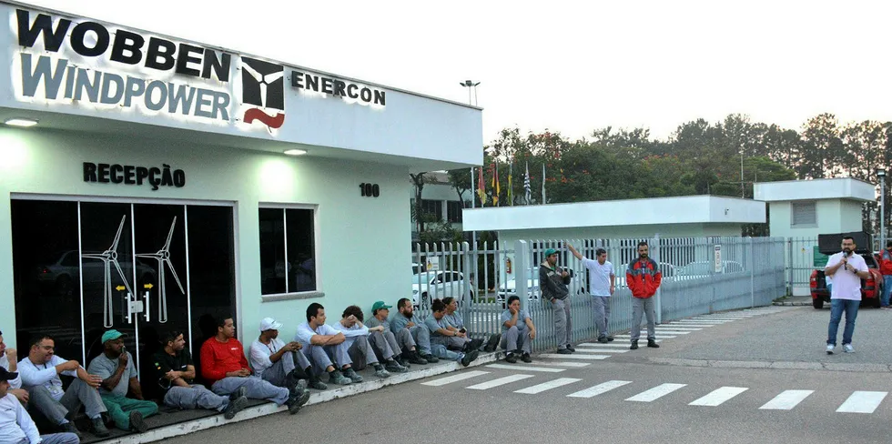 Workers meet at Enercon's Wobben Windpower factory in Brazil after earlier layoffs in May.