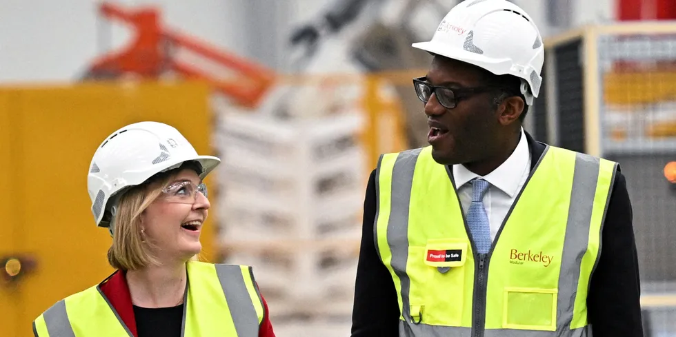 New UK prime minister Liz Truss and her new chancellor, Kwasi Kwarteng, the former energy secretary, share a smile on a visit to a manufacturing plant on Friday.