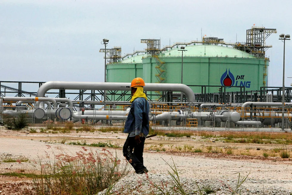 New finds needed: an employee of Thailand's PTT outside the company's LNG terminal at Map Ta Phut in Rayong province