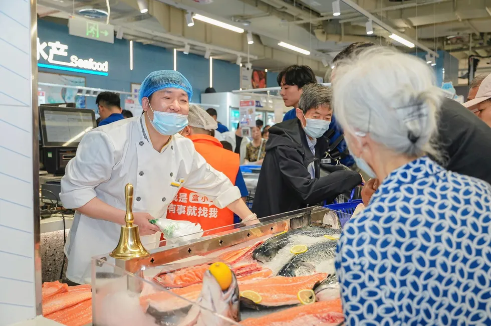 Norwegian salmon is freshly cut at a Shanghai branch of Alibaba-owned Hema.