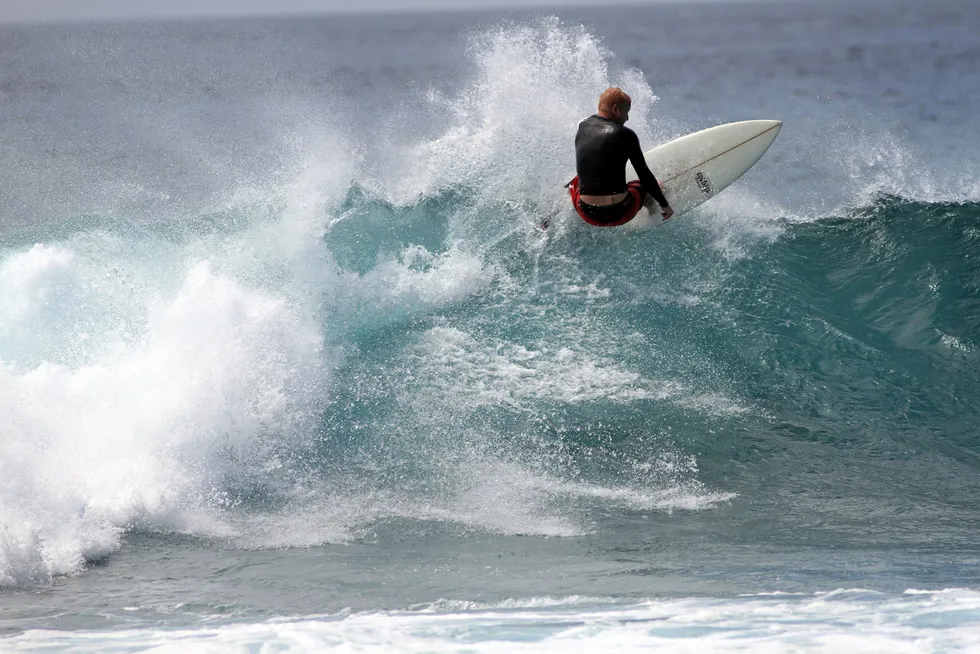 On a roll: Eco Atlantic chief executive Gil Holzman surfing offshore the Maldives