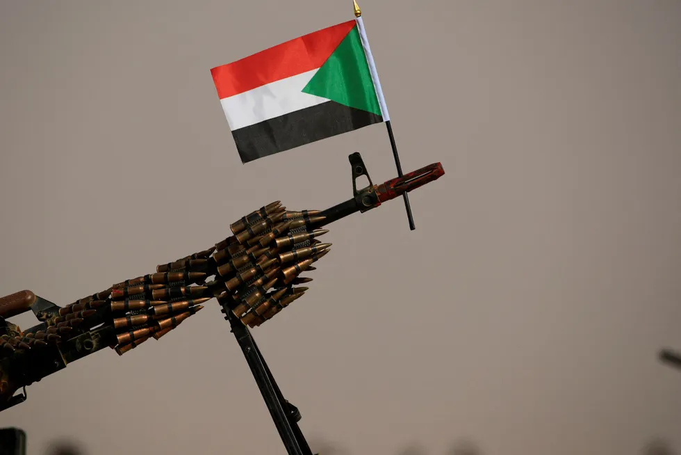 Sudan's national flag is attached to a machine gun of Paramilitary Rapid Support Forces.