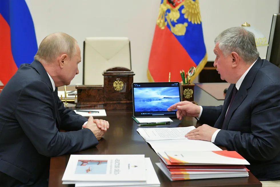 Concessions: Rosneft chief executive Igor Sechin (right) delivers a presentation on the Vostok Oil project to Russian President Vladimir Putin at the latter's Novo-Ogaryovo residence outside Moscow in May 2020