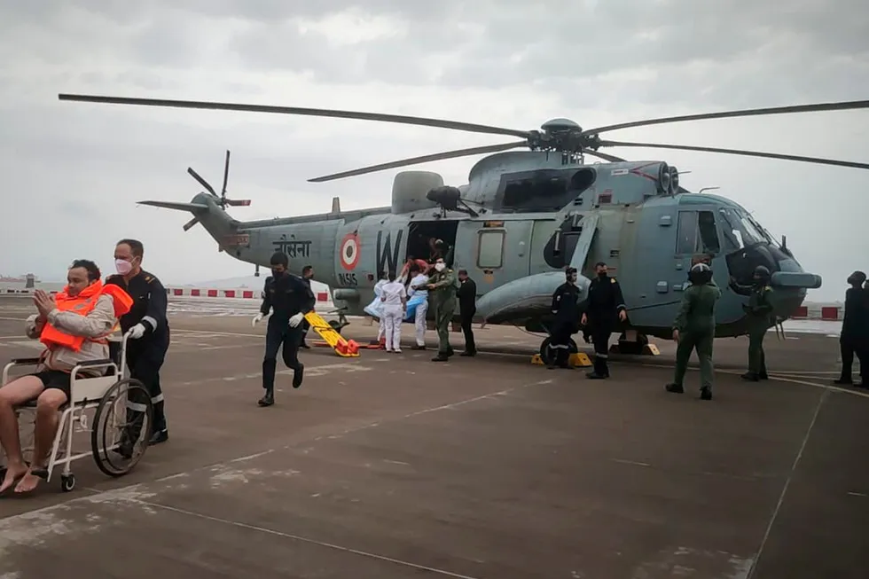 Cyclone Tauktae: a man been wheeled from an Indian Navy helicopter after being rescued in the Arabian Sea offshore India