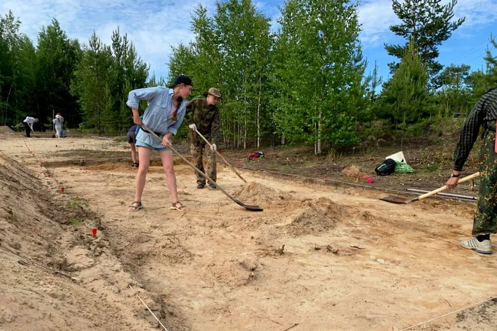 Interest: volunteers and students digging for ancient artefacts on the Lukoil-operated Nivagalskoye oilfield in West Siberia in Russia
