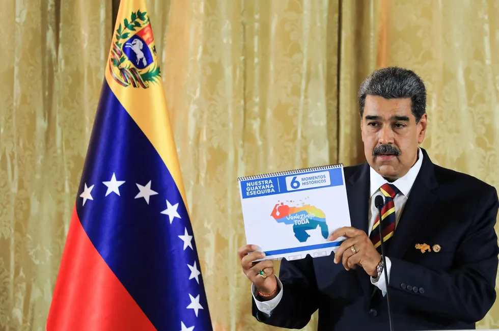 Decree: Venezuelan President Nicolas Maduro displaying the proposed new border featuring the Essequibo area