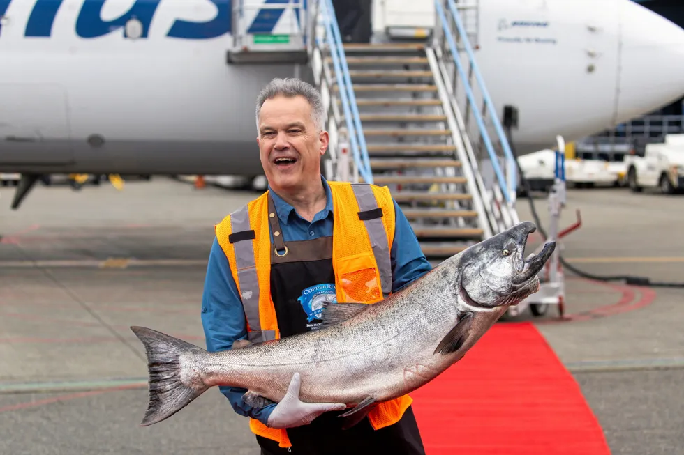 Alaska's Copper River season is right around the corner. Pictured: Greg McDole holds a 30-pound Chinook salmon at the Alaska Airlines Air Cargo Copper River salmon celebration delivery at Seattle-Tacoma International Airport in 2022.