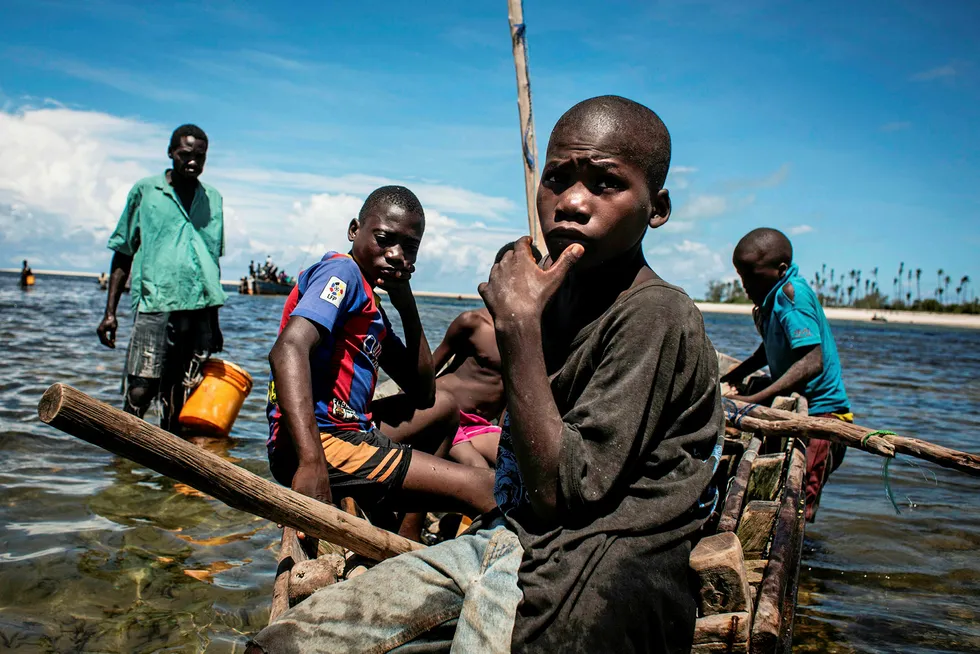 Changing lives: young fishermen return to shore after several days of fishing in Palma, Mozambique