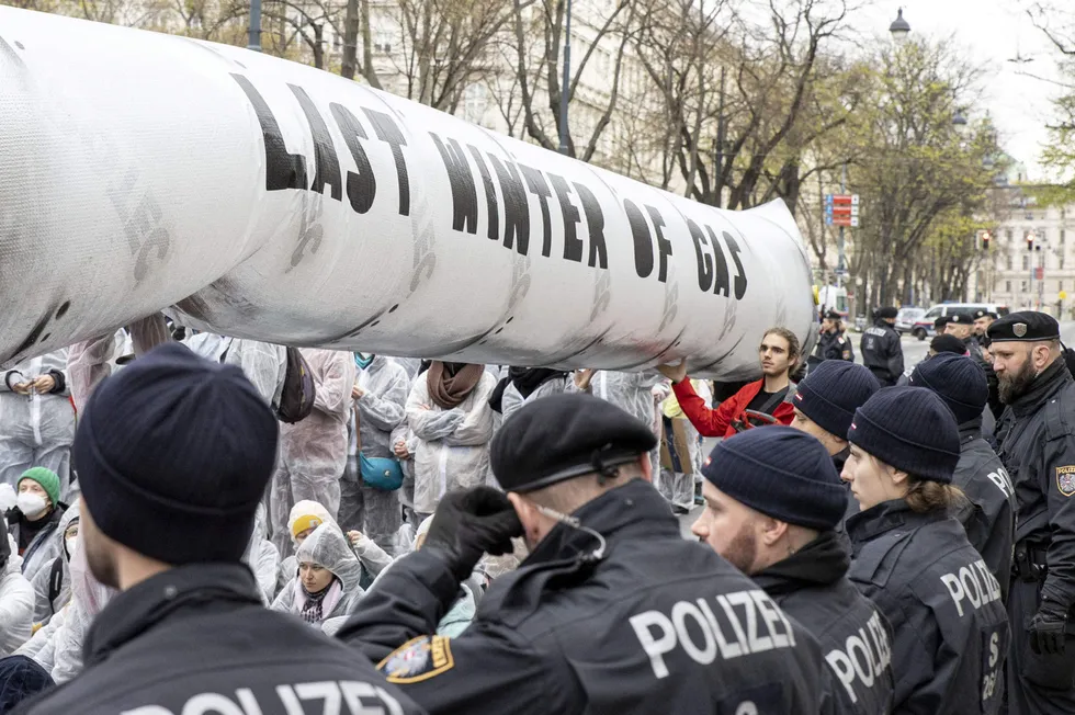 Policemen look on as protesters gather Vienna in March 2023, following a brutal winter of soaring natural gas prices as Europe adjusted to a new supply reality after Russia's invasion of Ukraine.