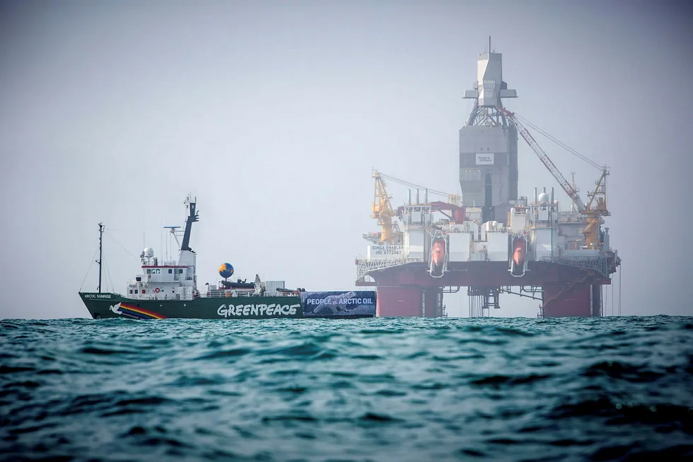 Protest: Greenpeace's Arctic Sunrise ship sails next to semisub Songa Enabler, operated by Statoil in the Barents sea