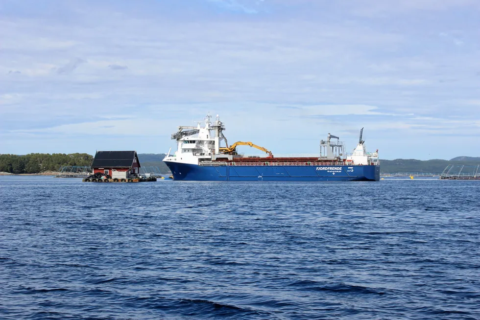 A barge transports feed to a Leroy Seafood salmon farm in Trondelag, Norway.
