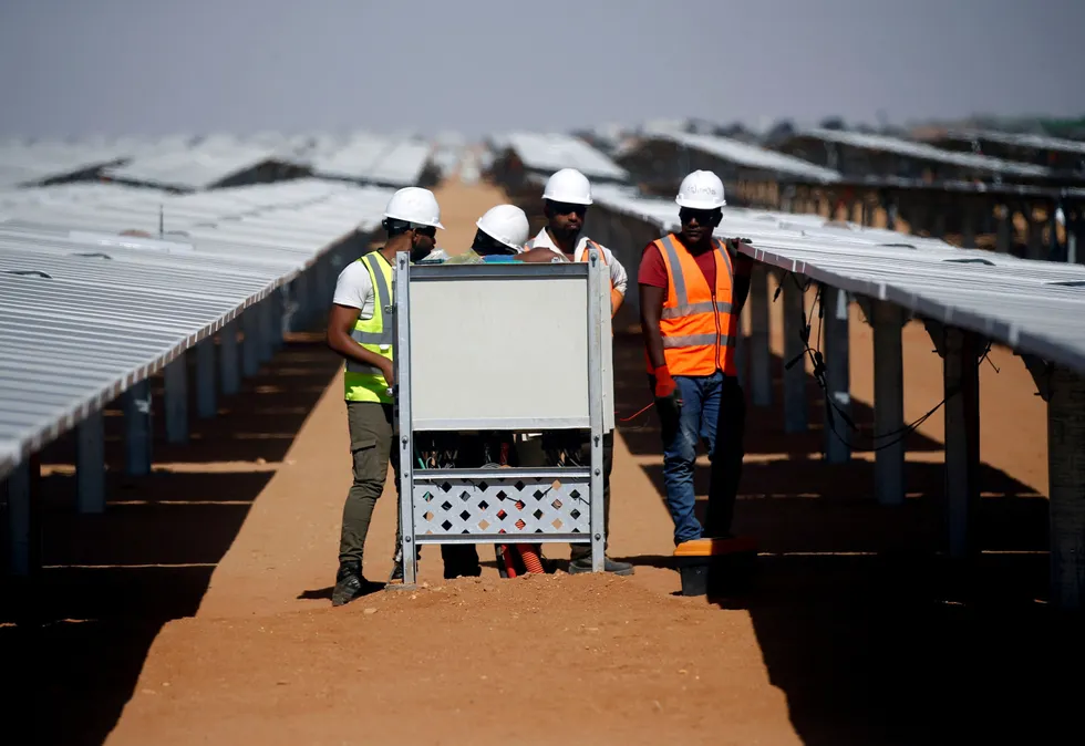 African potential: workers set up photovoltaic solar panels near Aswan in Egypt