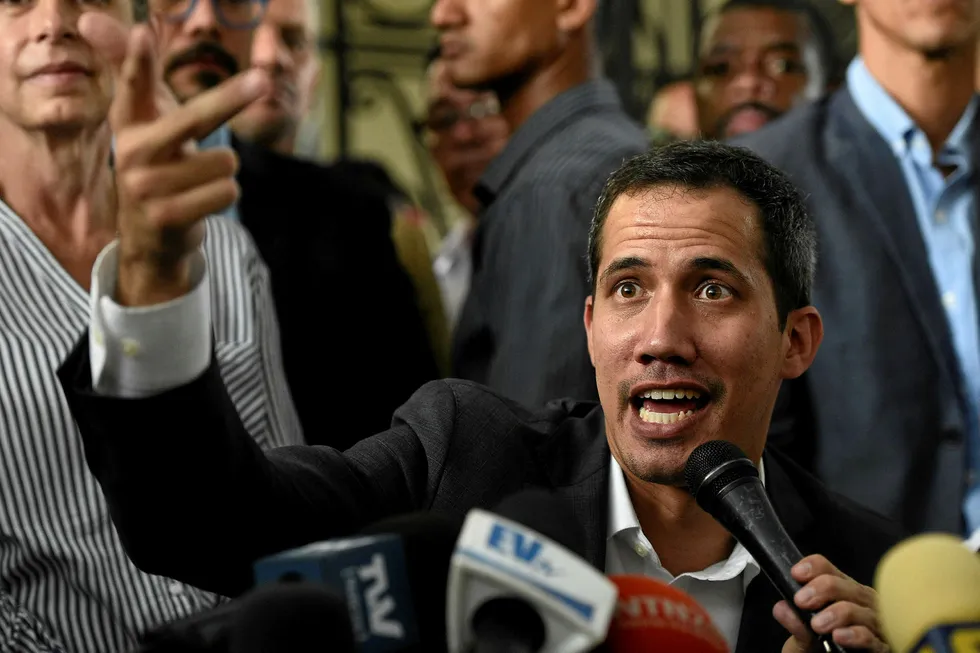 Keeping up the pressure: Venezuelan opposition leader and self-proclaimed acting president Juan Guaido gestures as he speaks during a press conference in Caracas this week