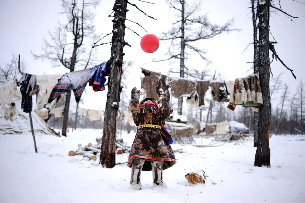 Lukoil support: children of indigenous reindeer herders play with a ball in Russia's remote Yamal-Nenets region