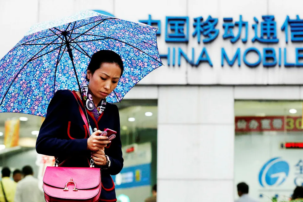 Verdens største mobiloperatør er ikke velkommen til å etablere seg i USA. Trump-regjeringen mener China Mobile utgjør en sikkerhetsrisiko. Foto: Aly Song/Reuters/NTB Scanpix
