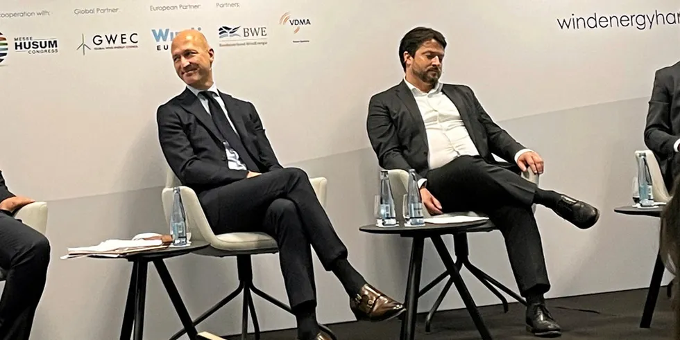 Sven Utermöhlen, left, talks at the WindEnergy Hamburg panel.