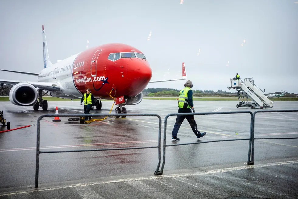 Norwegian-fly og -passasjerer på Haugesund lufthavn, fotografert ved en tidligere anledning.