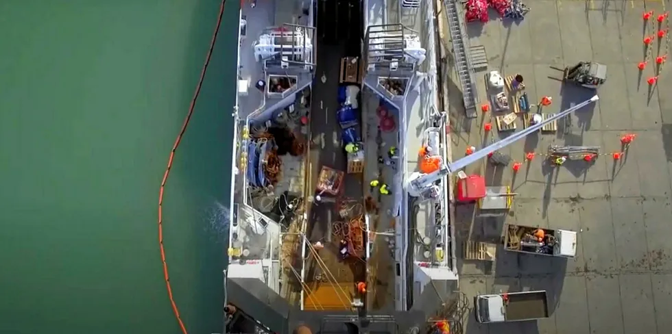 A New Zealand fishing vessel docks for a crew change.